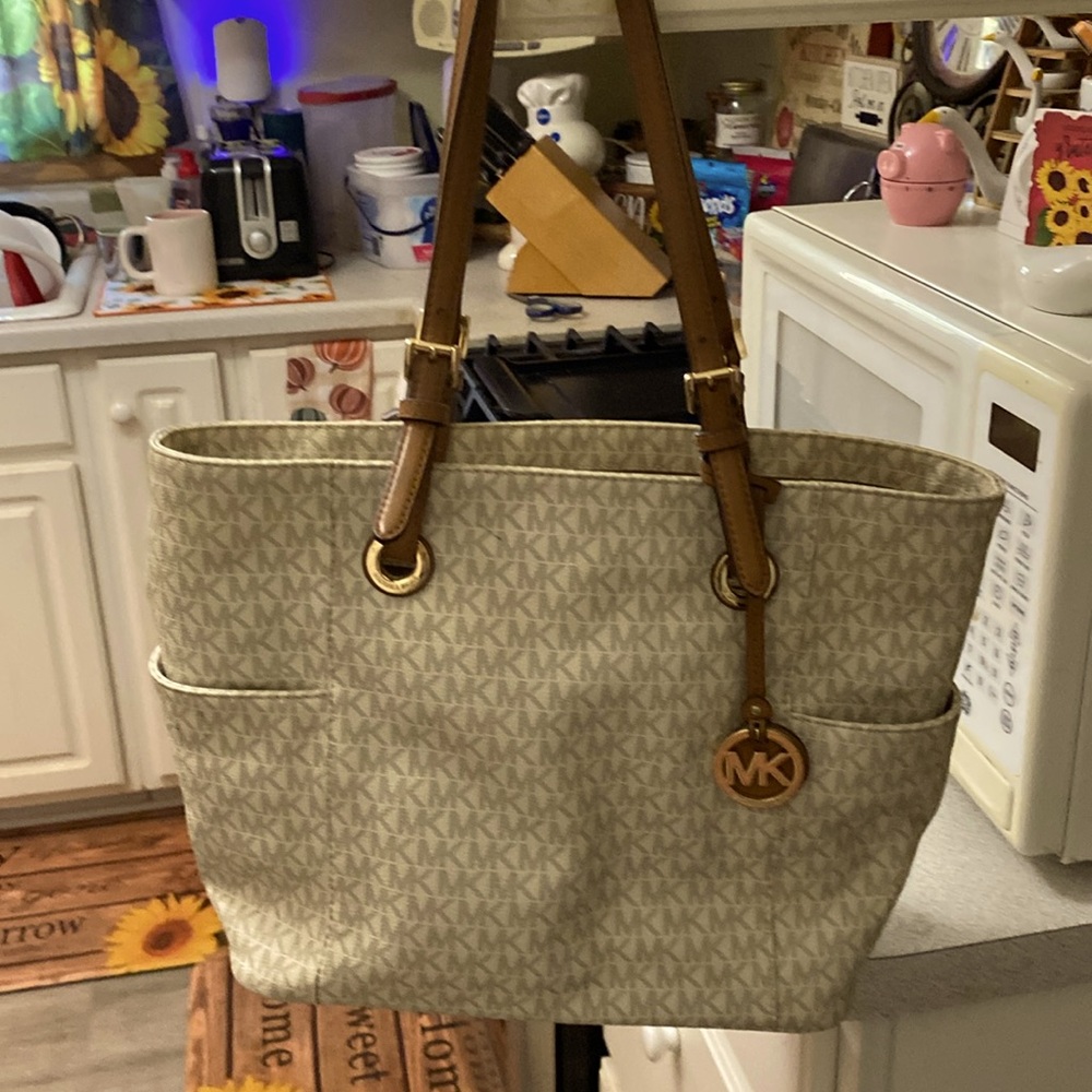 A white Michael Kors tote bag